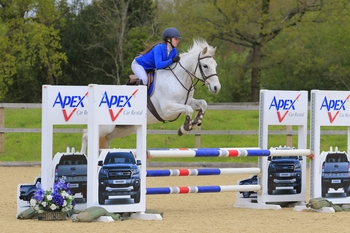 Lacey-Mae Russel seizes Victory in the STX-UK Pony British Novice Second Round at Felbridge Showground